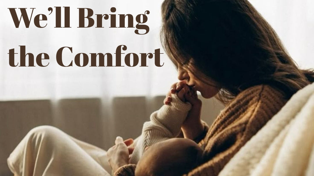 Mother breastfeeding baby comfortably using a nursing pillow in a cozy home setting