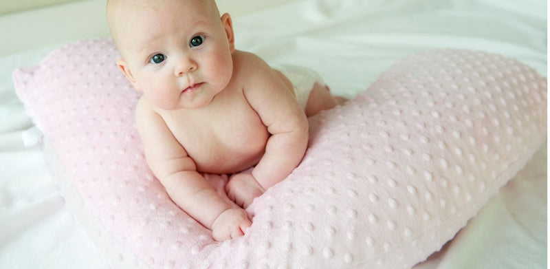 Plush baby pink cover for Luna Lullaby nursing pillow baby using for tummy time.