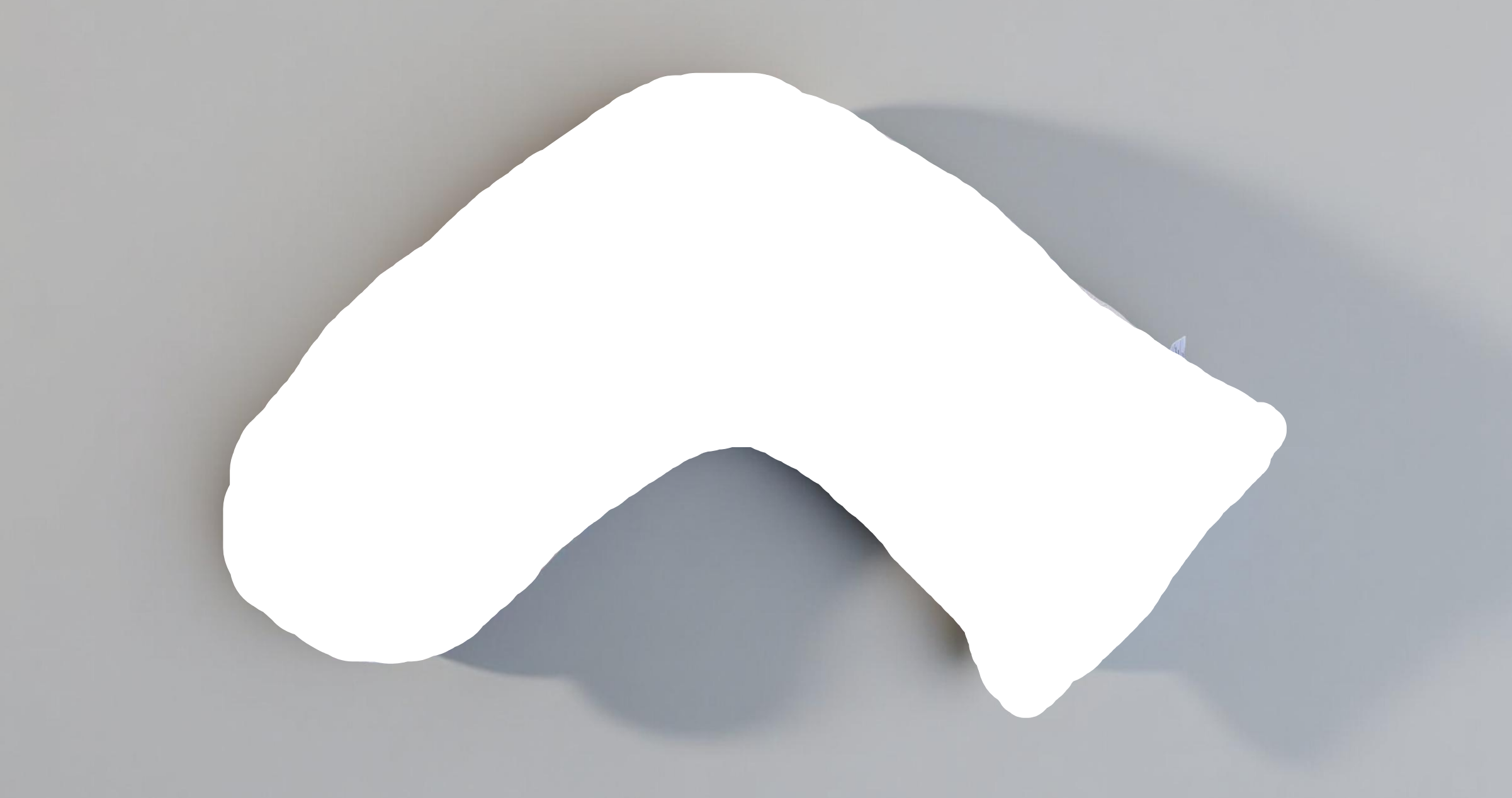 Luna Lullaby A beige, V-shaped nursing pillow on a grey background.