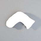 Luna Lullaby A beige, V-shaped nursing pillow on a grey background.