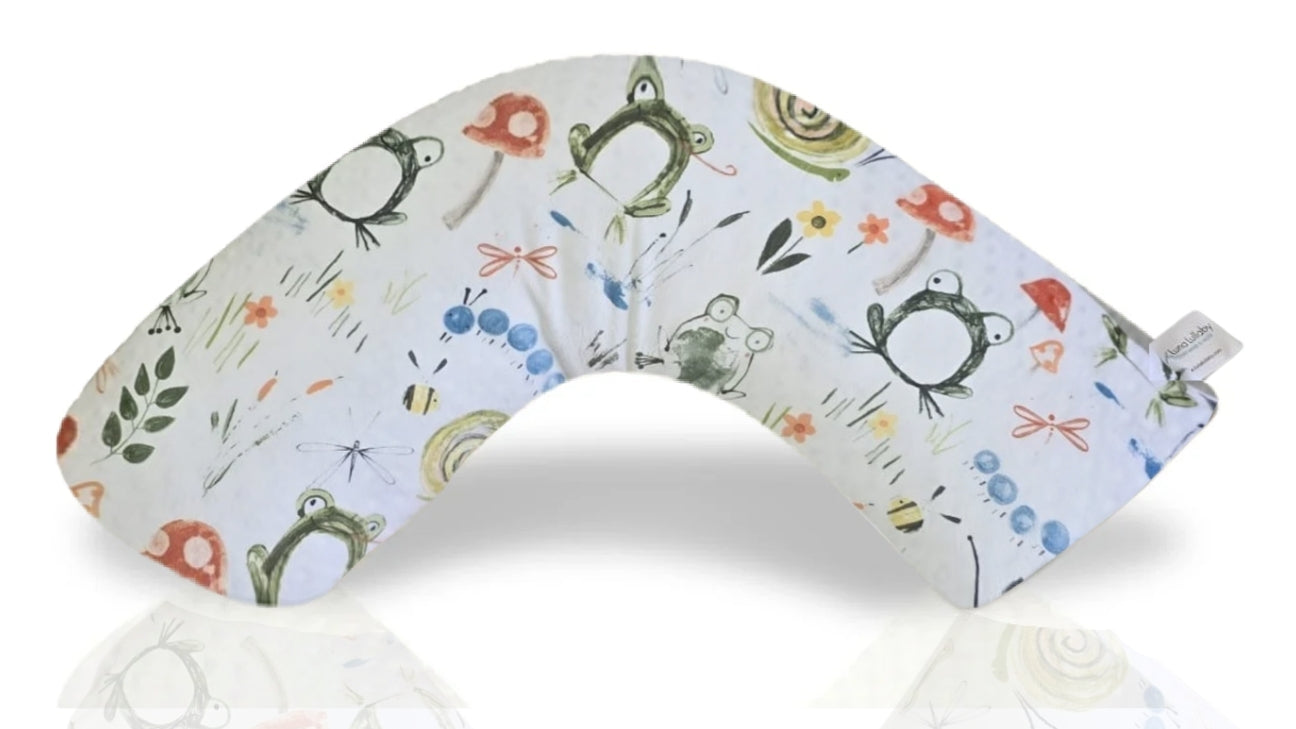 Nursing pillow with frog pattern on a white background