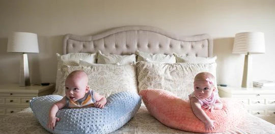 Twin babies on Luna Lullaby nursing pillow