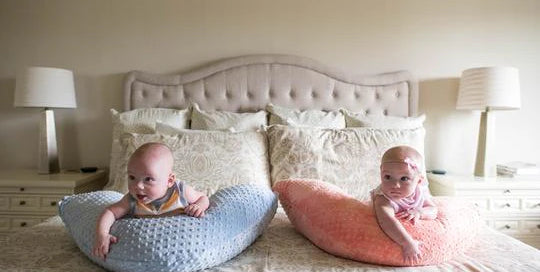 Twin babies on Luna Lullaby nursing pillow