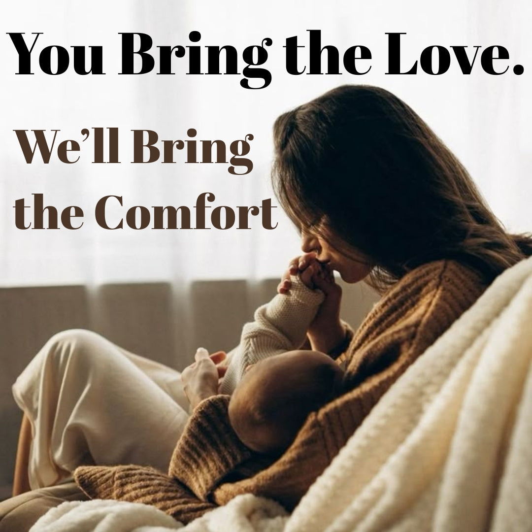 Mother breastfeeding baby comfortably using a nursing pillow in a cozy home setting